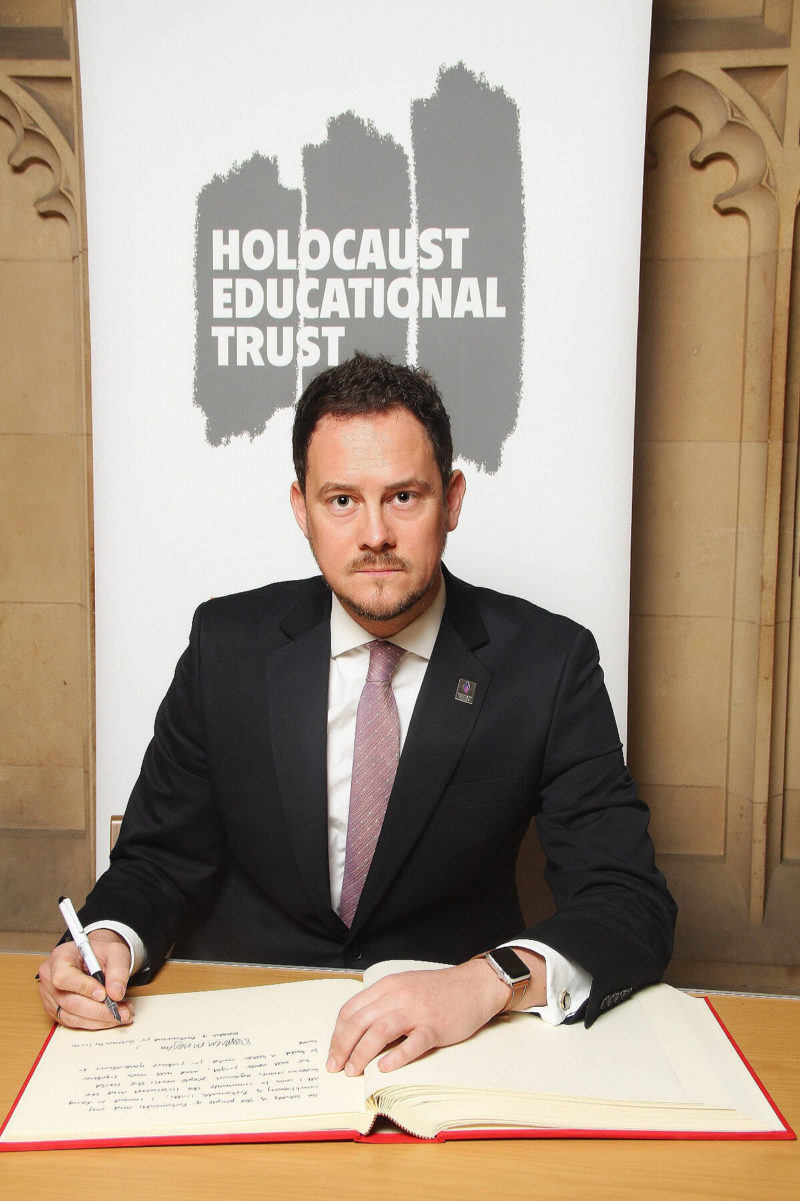 Stephen signing the Holocaust Educational Trust Book of Commitment
